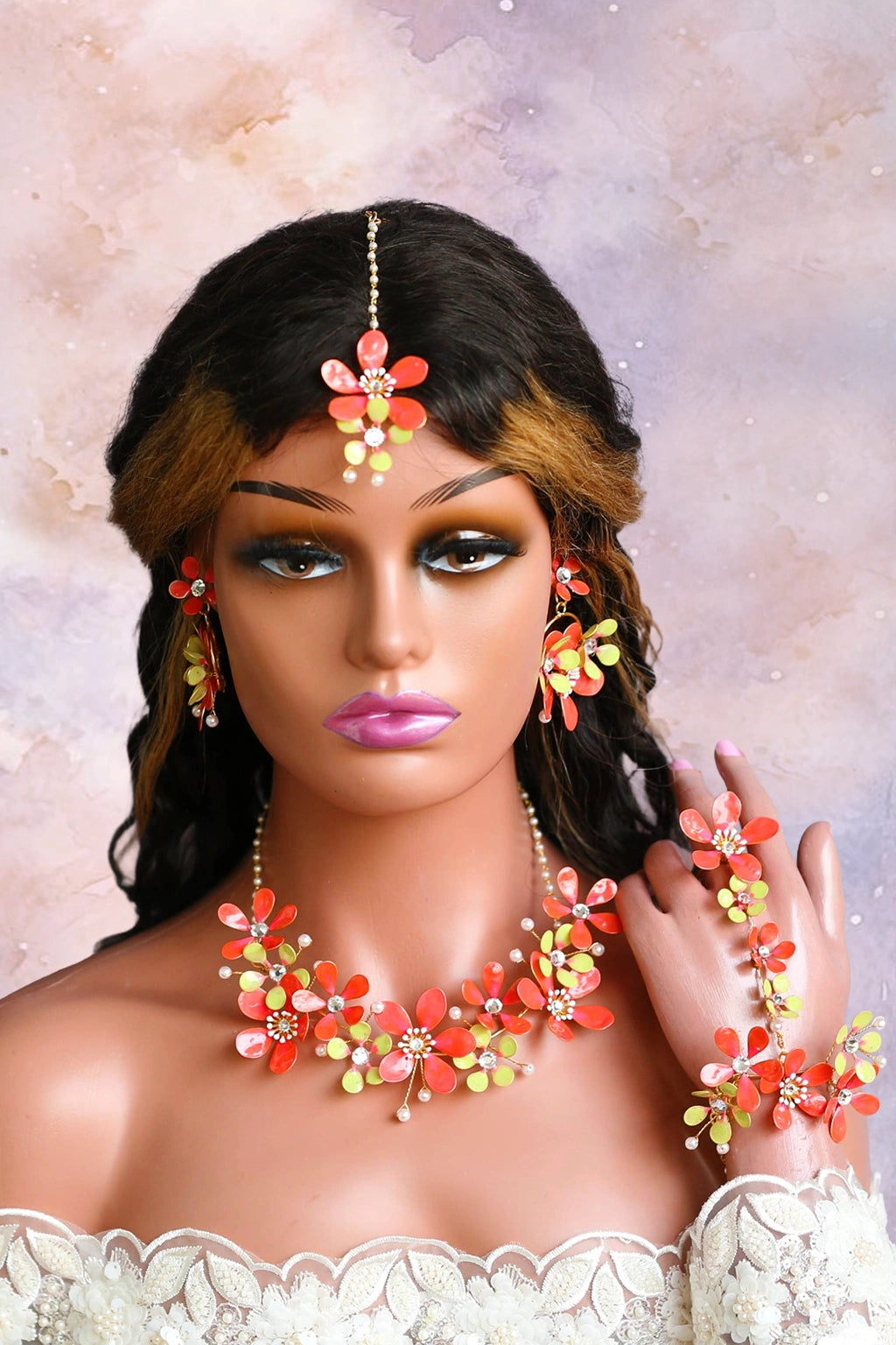 Handmade resin floral Haldi jewelry set for bride in red and lime green, including necklace, earrings, maang tikka and hathphool