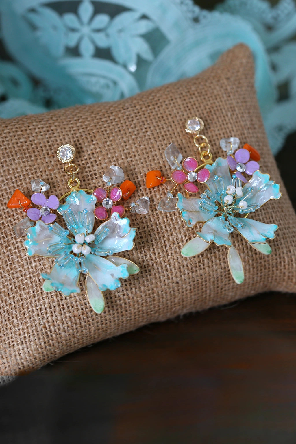 Handmade resin floral earrings in turquoise and pastel tones with gold-plated copper wire – lightweight customizable bridal jewelry by Seema Clay Jewelry.