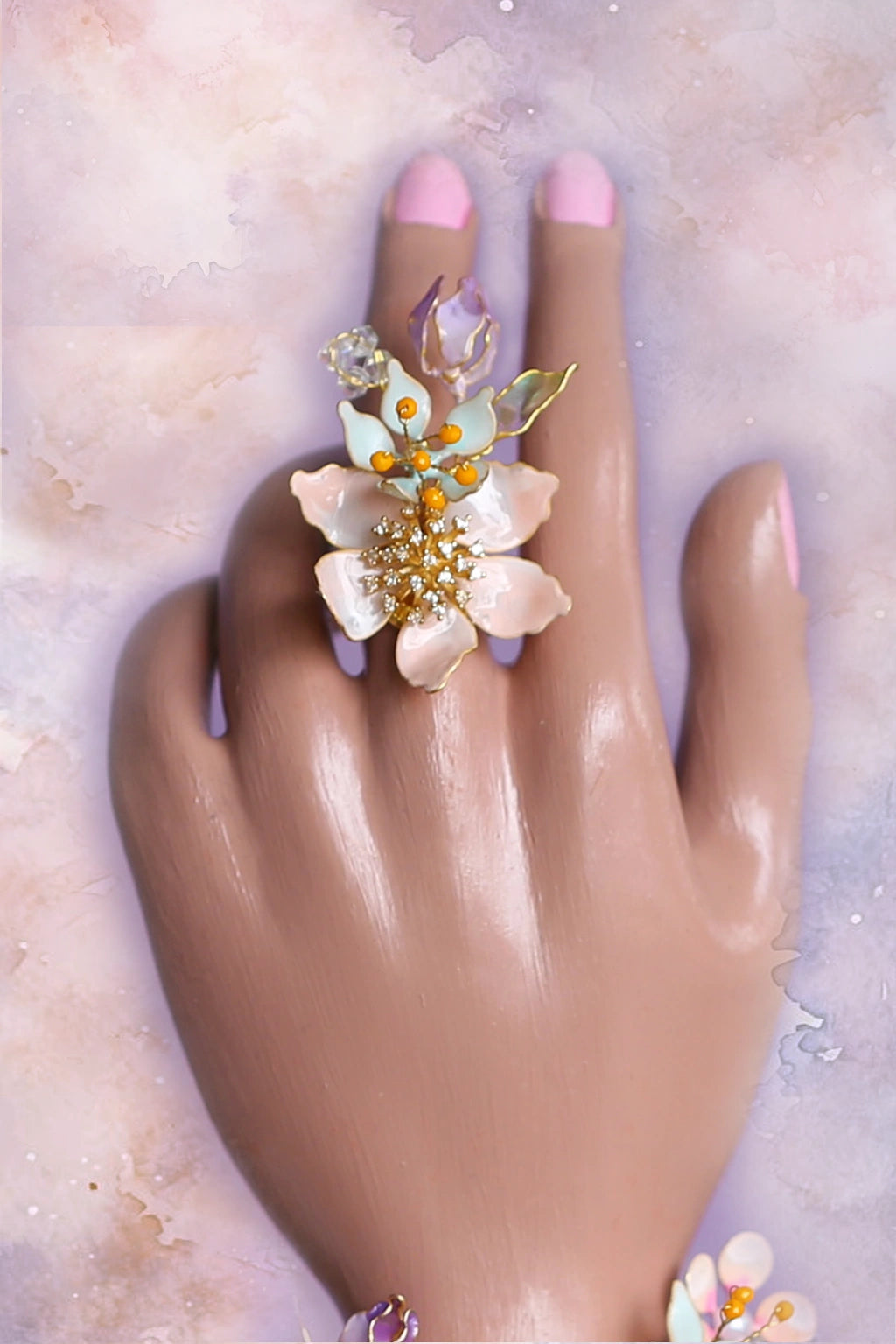 Coral Caress resin flower bridal finger ring with delicate gold-plated wire and pearl accents β part of a customizable handcrafted bridal jewelry set.