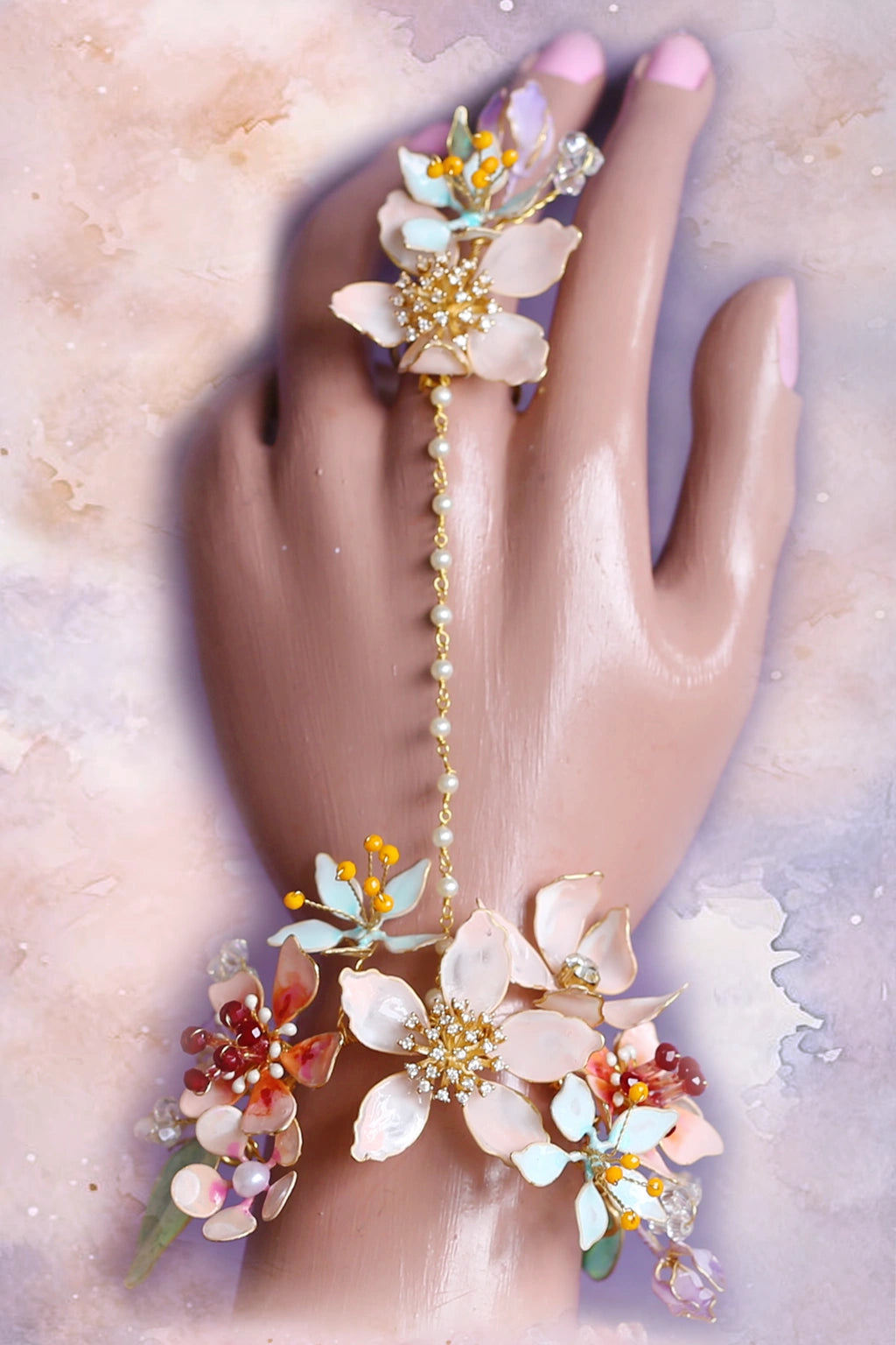 Coral Caress handmade resin flower haathphool with matching floral bracelet and finger ring, connected by a delicate pearl chain – customizable bridal hand jewelry for traditional and contemporary looks.