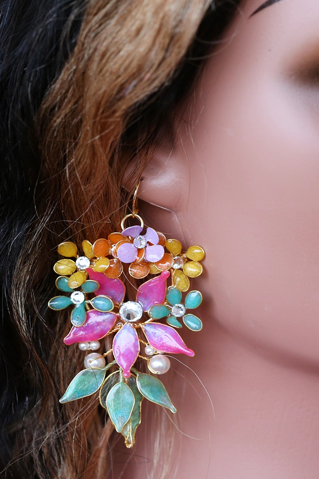 Mannequin wearing handmade resin flower bridal jewelry set featuring pink flowers with green and gold leaves — learn to create these earrings in the Rose Reverie resin jewelry class.