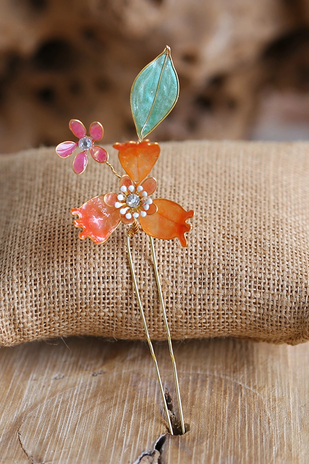 Handmade saffron resin floral bridal hair pin with peach petals, lightweight waterproof wedding hair accessory for haldi and mehendi