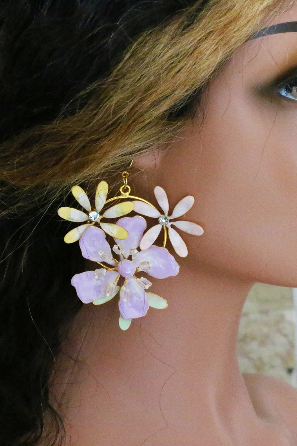 Close-up of woman wearing Handmade pastel lavender resin floral earrings with crystal accents and gold finish – Lavendula Lyra bridal earrings