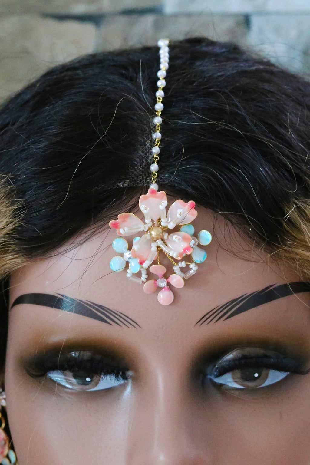 Seraphina’s Bloom handmade resin floral bridal maangtika in blush pink, aqua, and gold-plated copper – lightweight, customizable, waterproof wedding forehead accessory.