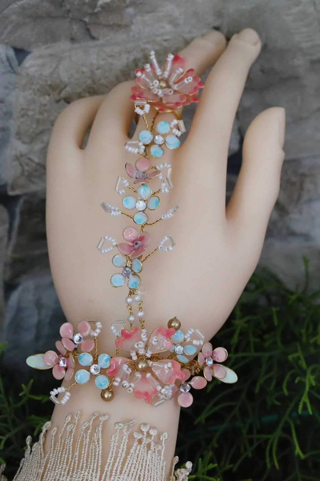 Seraphina’s Bloom handmade resin floral haathphool with finger ring in blush pink, aqua, and gold-plated copper – lightweight, waterproof, customizable bridal hand jewelry.