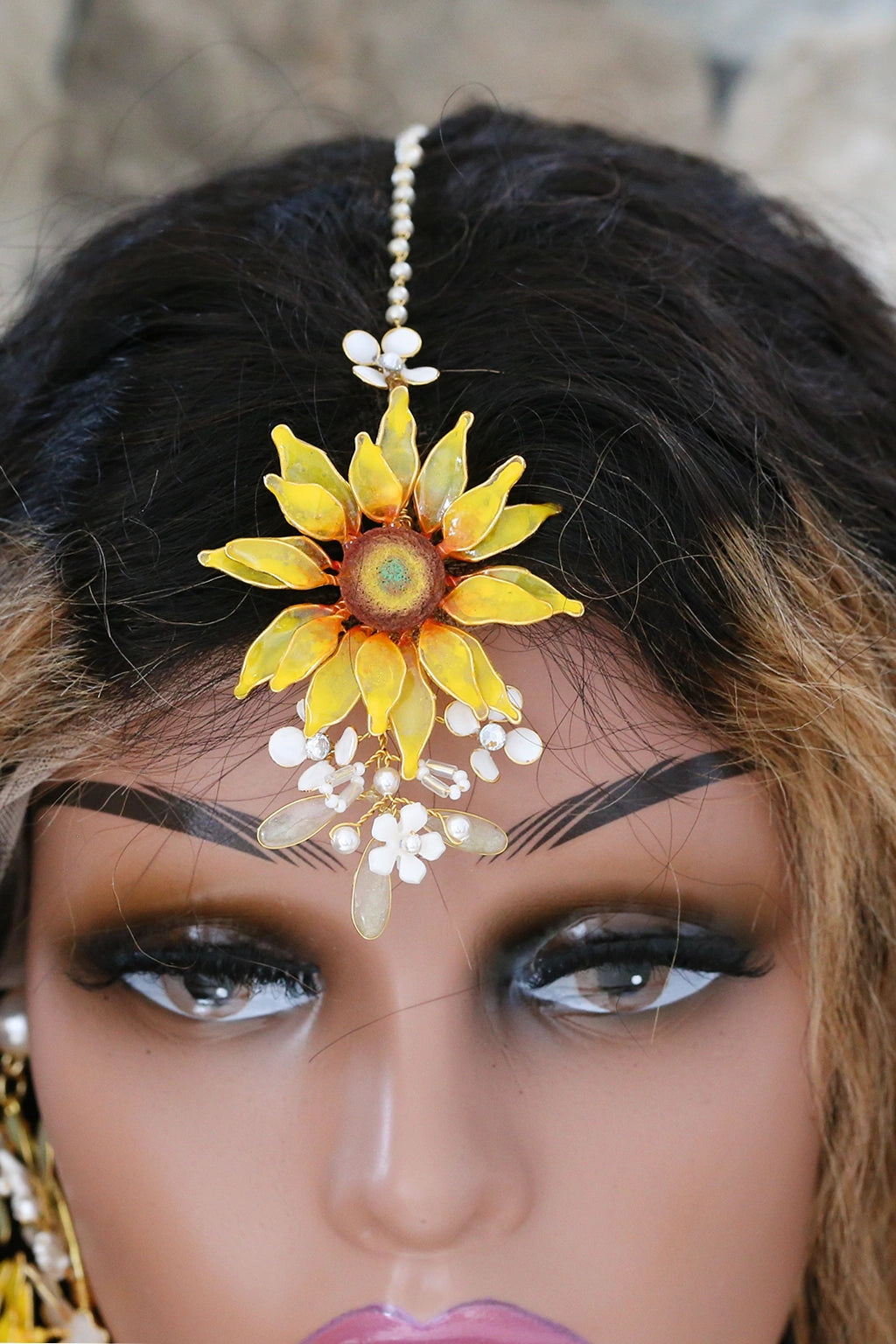 Handmade resin sunflower bridal maangtika with white floral and pearl accents – lightweight, customizable Haldi & Mehndi jewelry.