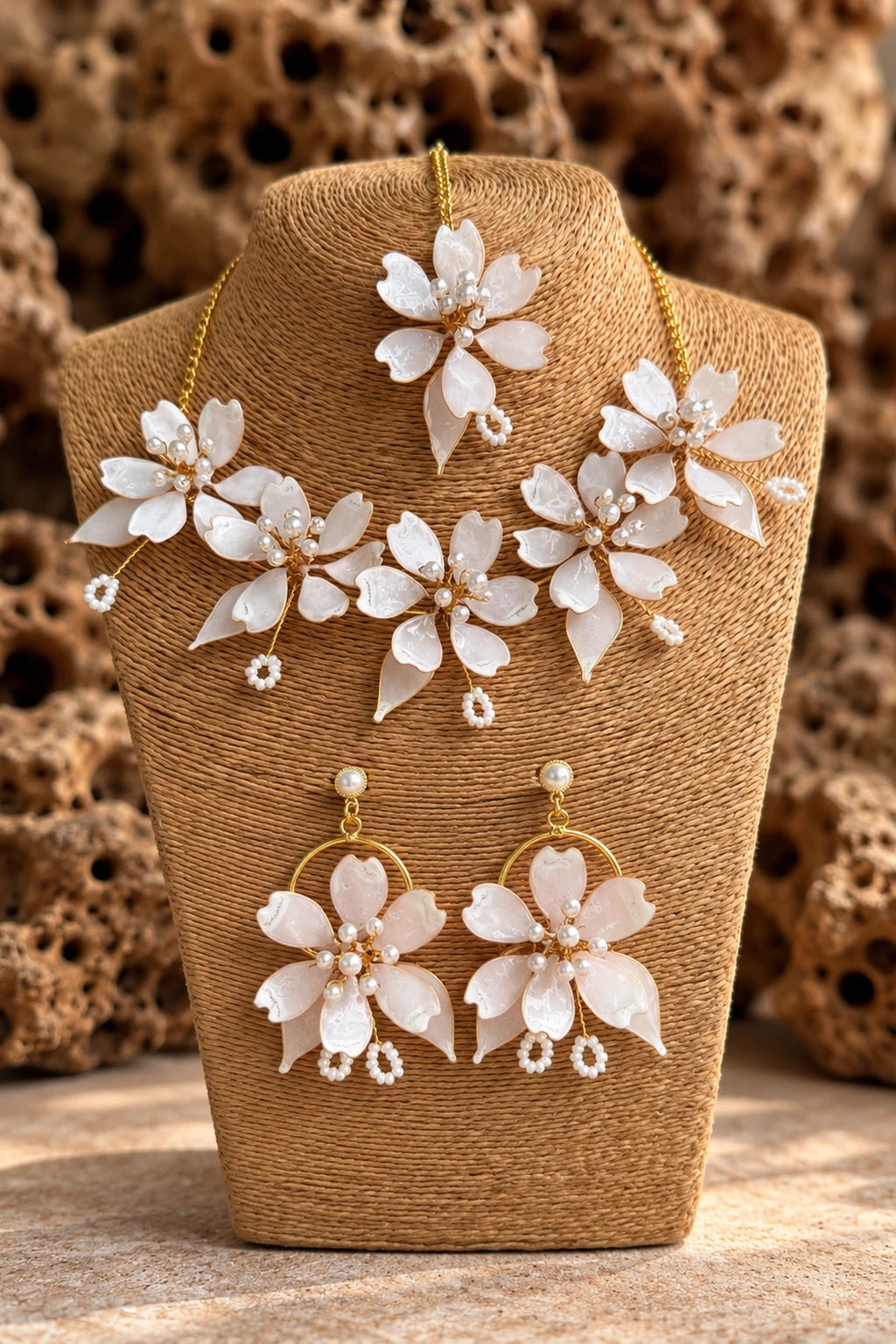 White Pearl Resin Flower Bridal Jewelry Set with Necklace, Earrings and Maangtika on display stand