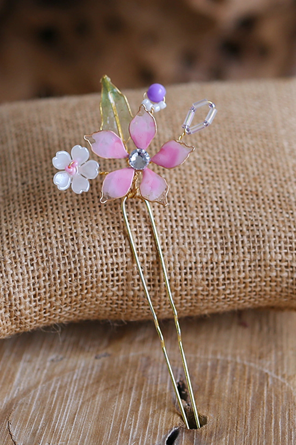 Handmade pink resin floral bridal hair pin with bead accents and crystal centre, lightweight waterproof wedding hair accessory for bridal bun