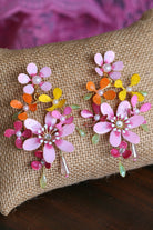 Handmade resin floral earrings with pink, orange, and yellow petals, pearl accents, and gold wire detailing – lightweight bridal earrings for haldi or mehndi.