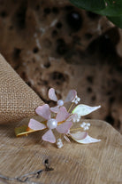 Handmade Aurora’s Whisper resin floral hairpin in soft blush pink and pearl, crafted with gold-plated copper wire – lightweight, customizable bridal hair accessory.
