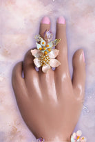 Coral Caress resin flower bridal finger ring with delicate gold-plated wire and pearl accents – part of a customizable handcrafted bridal jewelry set.