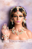 Full bridal look featuring the Coral Caress handmade resin floral jewelry set – includes necklace, earrings, haathphool, bracelet, finger ring, and head jewelry – lightweight, gold-plated, and customizable to match any wedding outfit.

