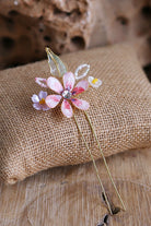 Handmade resin floral bridal hair pin in blush pink with gold U-pin base

Lightweight waterproof floral wedding hair accessory for brides

Pastel pink resin flower hair pin for bridal bun hairstyle