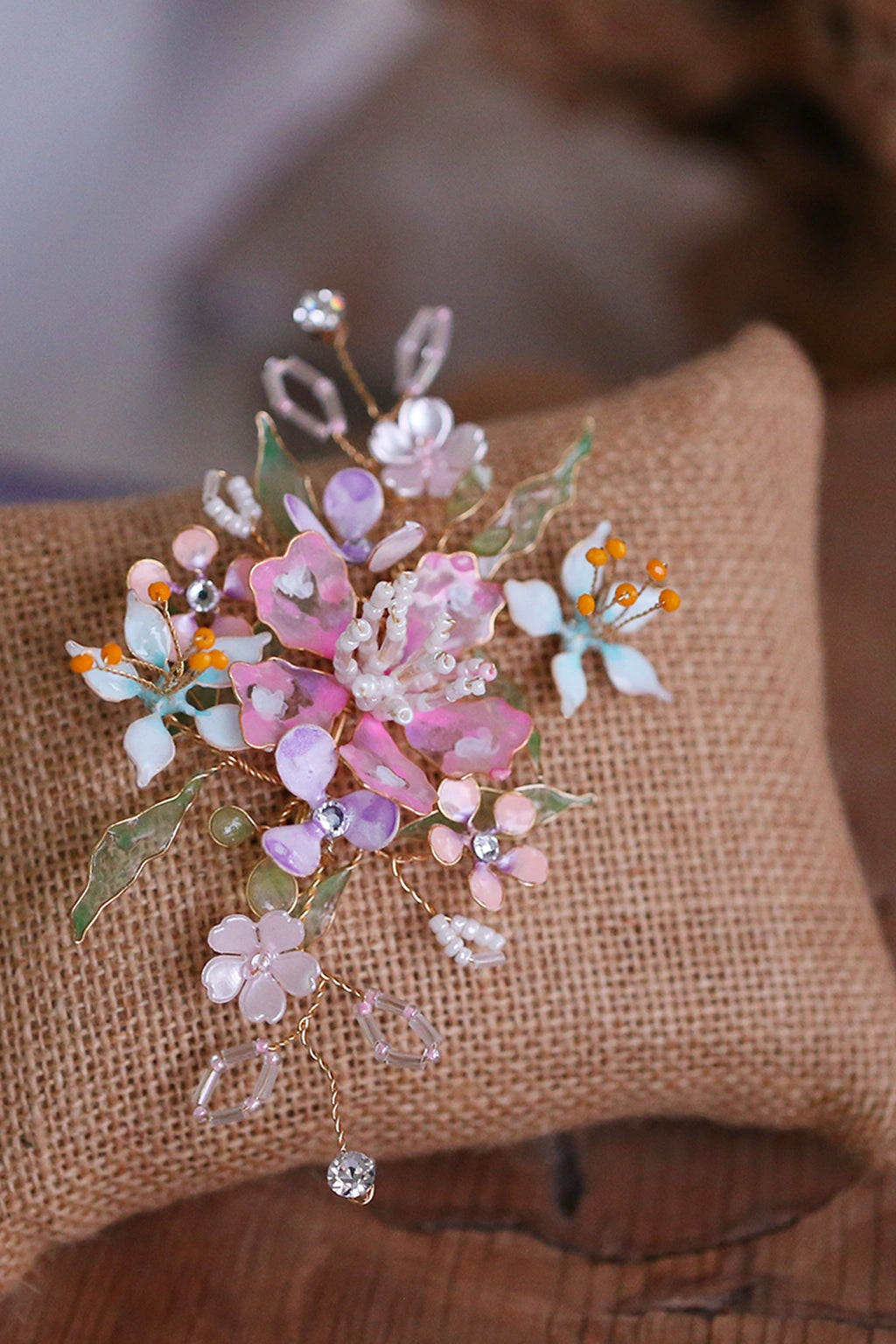 Handmade pastel floral resin bridal hair accessory with pearls and crystals from Seema Clay Jewelry, part of the Elysian Blossom bridal jewelry set.