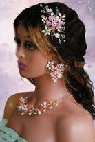 Bride wearing handmade pastel floral resin bridal jewelry set with necklace, earrings, hair accessory and ring – lightweight customizable waterproof design