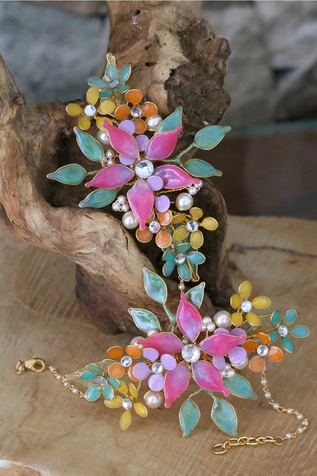 Handmade resin flower bridal haathphool set featuring pink flowers with green and gold leaves — learn to create these hand harness in the Rose Reverie resin jewelry class.