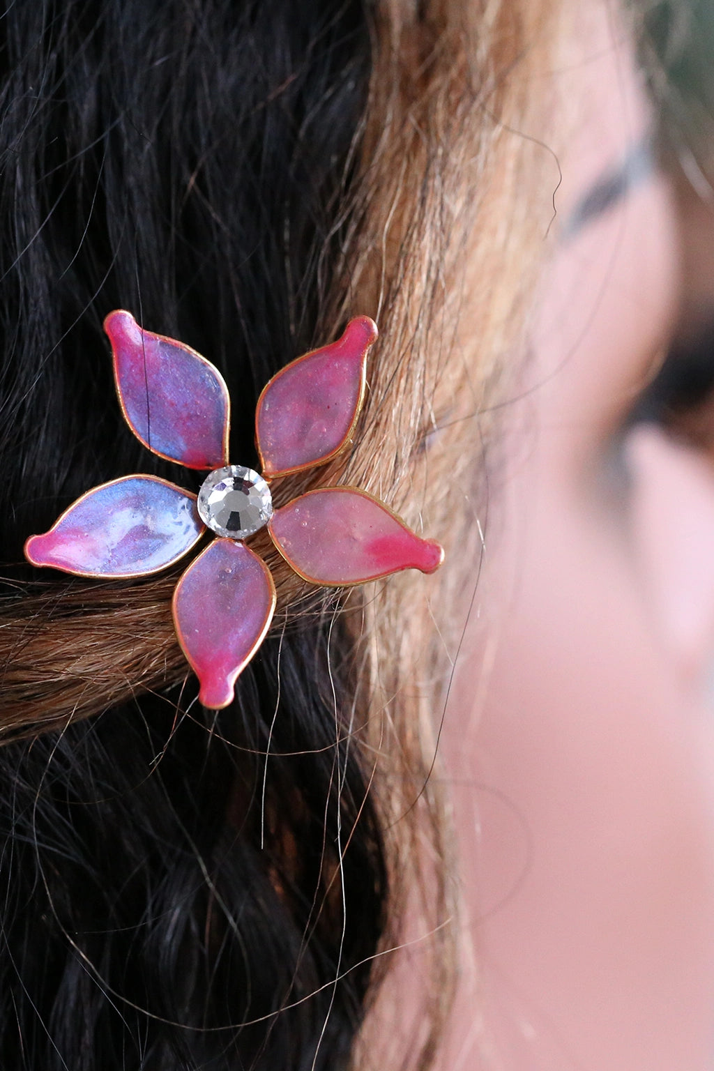 Mannequin wearing handmade resin flower hairpin featuring pink flower - learn to create this hairpin in the Rose Reverie resin jewelry class.