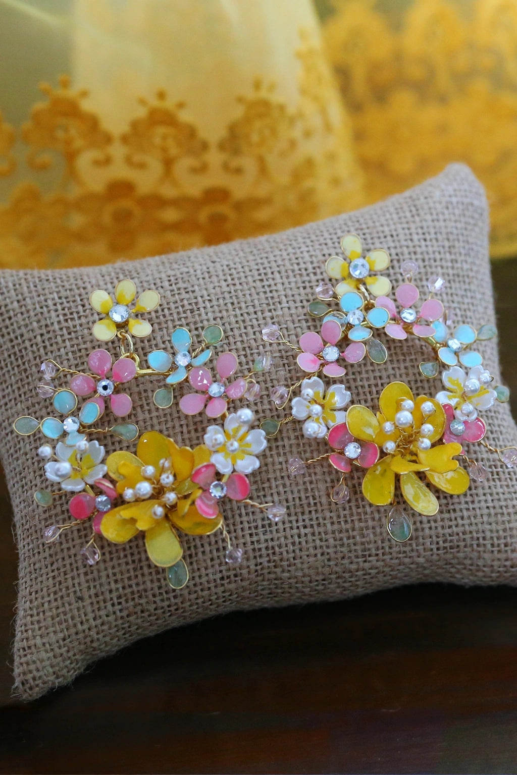 Haldi Radiance handmade resin earrings with marigold yellow, pink, aqua, and white floral designs in gold-plated wire – lightweight customizable bridal jewelry by Seema Clay Jewelry.