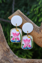 Handmade polymer clay earrings featuring pink lotus flowers framed in gold, lightweight and waterproof customizable floral jewelry for women and girls