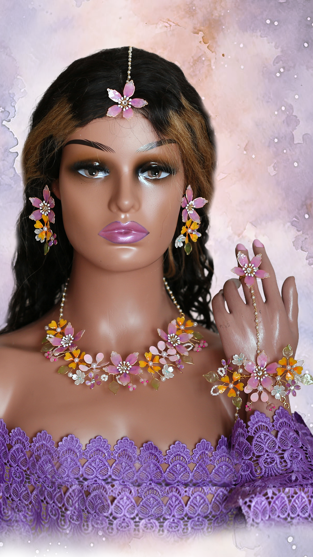 Bride wearing Manaswini handmade resin floral bridal jewelry set with necklace, earrings, maangtika, hand harness and finger ring in pastel mauve and yellow floral design for Haldi and Mehendi ceremony