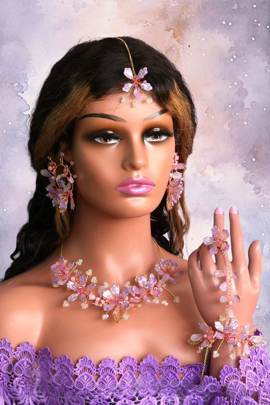 Handmade Mystic Mauve resin floral bridal jewelry set featuring necklace, earrings, maangtika, hand harness and finger ring crafted with gold-plated copper wire and mauve resin flowers.
