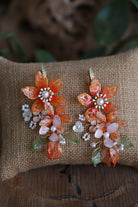 Handmade orange resin floral bridal earrings with pearls and gold wire design – lightweight customizable earrings by Seema Clay Jewelry