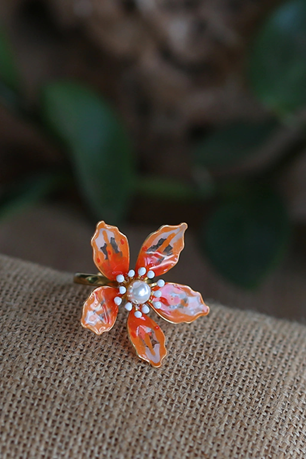 Handmade saffron orange resin floral adjustable ring with pearl center – lightweight bridal jewelry by Seema Clay Jewelry