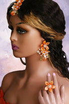 Women wearing Handmade orange resin floral bridal earrings, finger ring and Maangtika