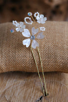 Handmade ivory resin floral bridal hair pin with pearl accents, lightweight waterproof wedding hair accessory for brides