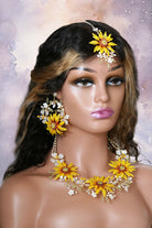 Mannequin wearing Handmade resin sunflower bridal maangtika with white floral and pearl accents – lightweight, customizable Haldi & Mehndi jewelry.