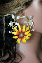 Close up of Handcrafted resin sunflower earrings on mannequin with delicate white and green floral accents, perfect for haldi, mehndi, bridal, and festive occasions. Lightweight and customizable.
