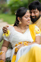 Real Bride wearing Handmade resin floral bridal earrings with pearl hair harness – Vaishnavi’s White Blossom – lightweight customizable wedding jewelry