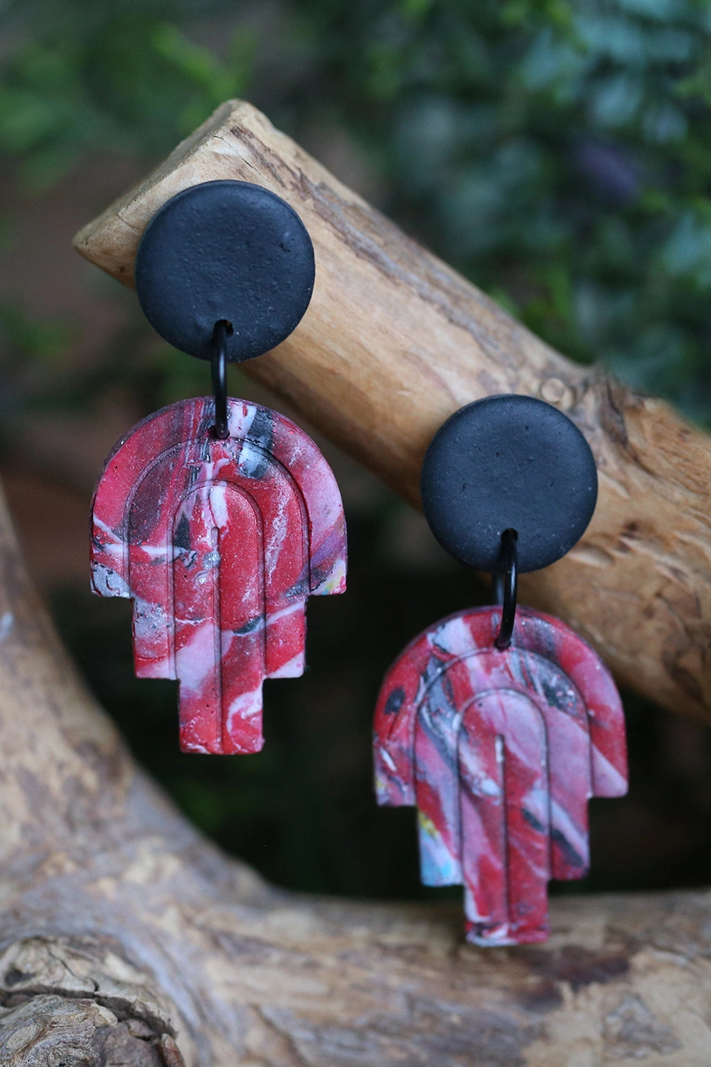 Handmade red marbled polymer clay arch earrings made with FIMO Germany clay lightweight waterproof modern geometric statement jewelry by Seema Clay Jewelry