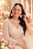 Bride wearing White Pearl Resin Flower Bridal Necklace, Earrings and Maangtika